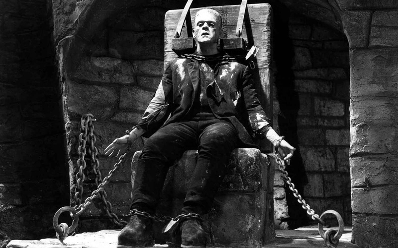 art and craft, spirituality, low angle view, outdoors, history, movies, built structure, representation, photo, Boris Karloff, statue, the past, grayscale