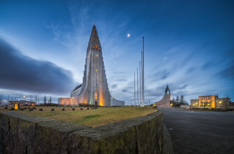 sky, car, skyscraper, government, trees, built structure, city, architecture, travel, illuminated, memorial, history, lights, stones, field, statue, building exterior