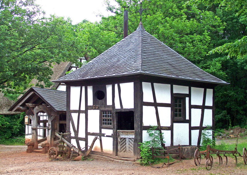history, wood - material, hammer, nature, village, gazebo, building exterior, built structure, metal, glow, green color, outdoors, armor, day, middle ages