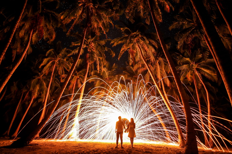 real people, bright, fire - Natural Phenomenon, exploding, burning, man, orange, firework - Man Made Object, heat - Temperature, spinning, holding hands
