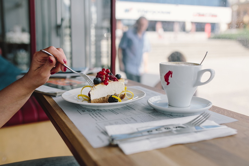 kitchen utensil, enjoying, time, sweet, cheese cake, crockery, spoon, ready-to-eat, hand, eating utensil, incidental people, cafeteria, cake, dessert, cheese