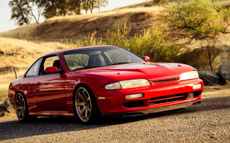 day, land vehicle, nature, outdoors, retro styled, no people, road, red, land, focus on foreground, vintage car, wealth, luxury, tree, car, JDM, Nissan S14