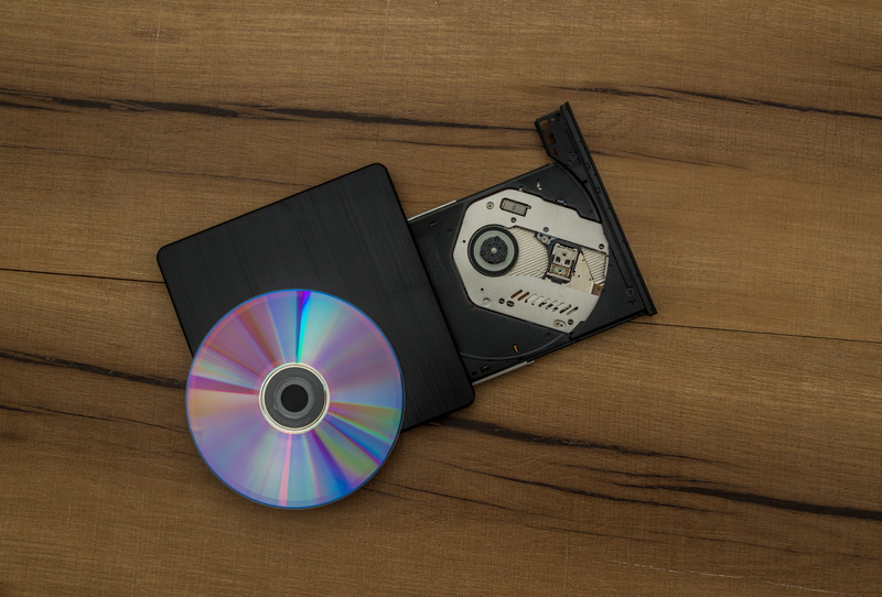 music, record, circle, cd rom, retro styled, table, writer, close-up, disk, drive, shape, wood - material, cd, directly above, still life, no people, high angle view