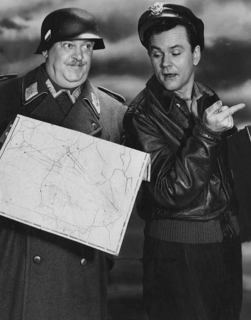 sgt schultz, bob crane, hogan, hogans heroes, holding, real people, young adult, smiling, retro, klink, togetherness, two people, hollywood, tv, men, males