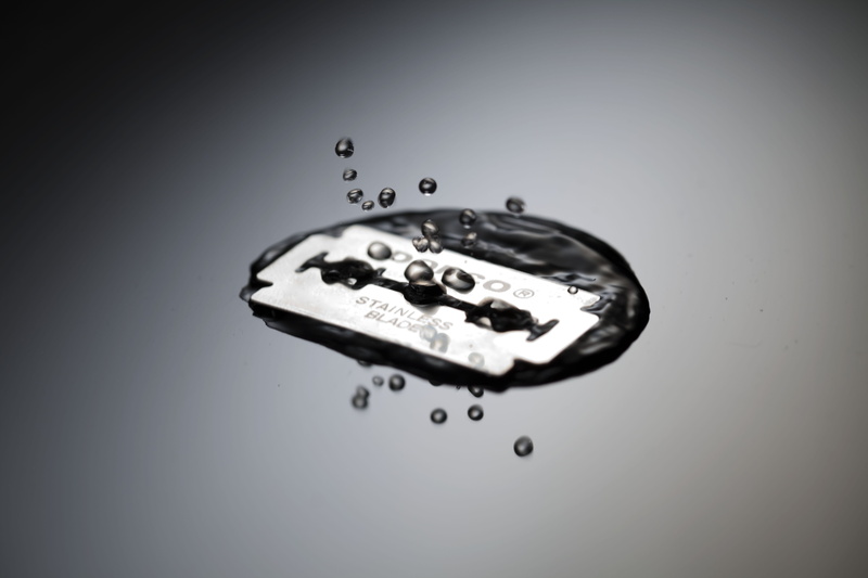 high speed, output, blade, razor, water, razor blade, 5K, studio shot, close-up, exercise, motion, gray background, falling, colored background, drop
