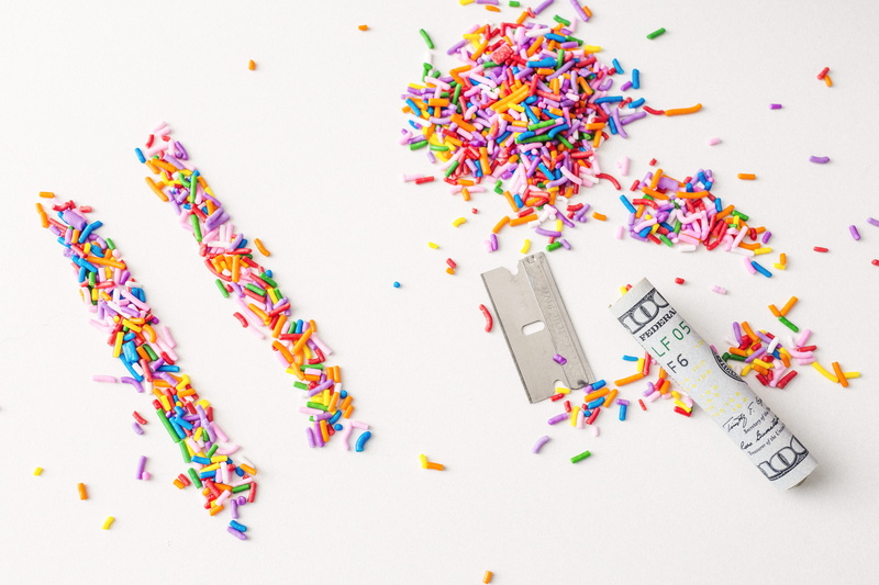 fake, food and drink, sprinkles, drugs, still life, candy, red, high angle view, celebration, colors, western script, multi Colored, razor, bill, humor