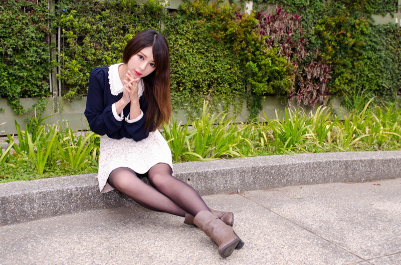 real people, women, leisure activity, zhang qi jun, emotion, hairstyle, long hair, outdoors, wireless technology, young adult, one person, sitting, beauty