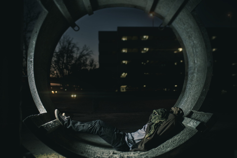 laying, dark, lights, nature, real people, lying on back, night, person, rig, one person, building, casual clothing, city, homeless, misfortune, window
