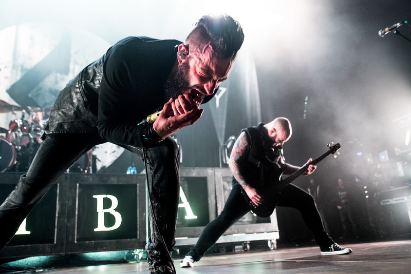 Metalcore, s, full length, Caliban, playing, music, performance, bending, adult, illuminated, 2K, lifestyles, effort, side view, indoors, stage, casual clothing