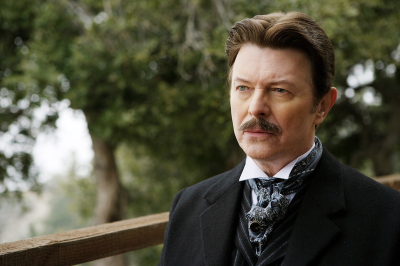 heterochromia, portrait, one person, outdoors, David Bowie, corporate business, well-dressed, trees, men, mature adult, serious, depth of field, moustache
