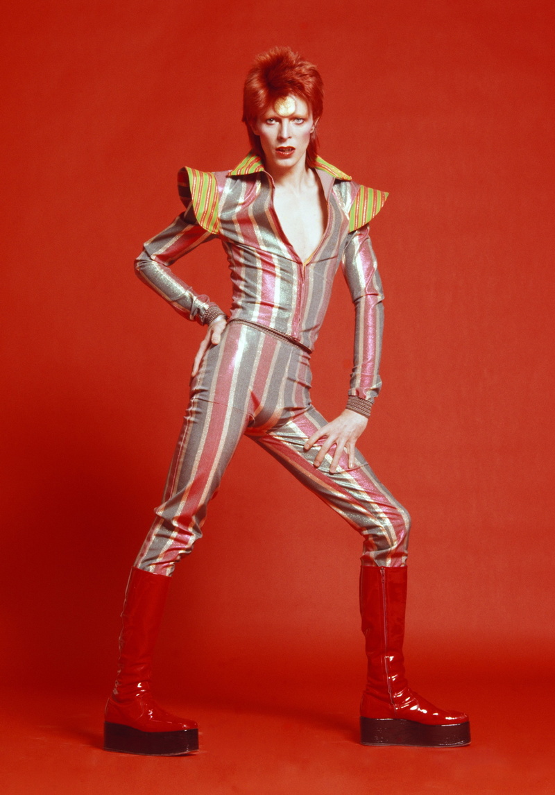 front view, david bowie musicians looking at viewer, adult, fashion, shoe, one person, studio shot, portrait, smiling, 2K, young adult, beautiful woman