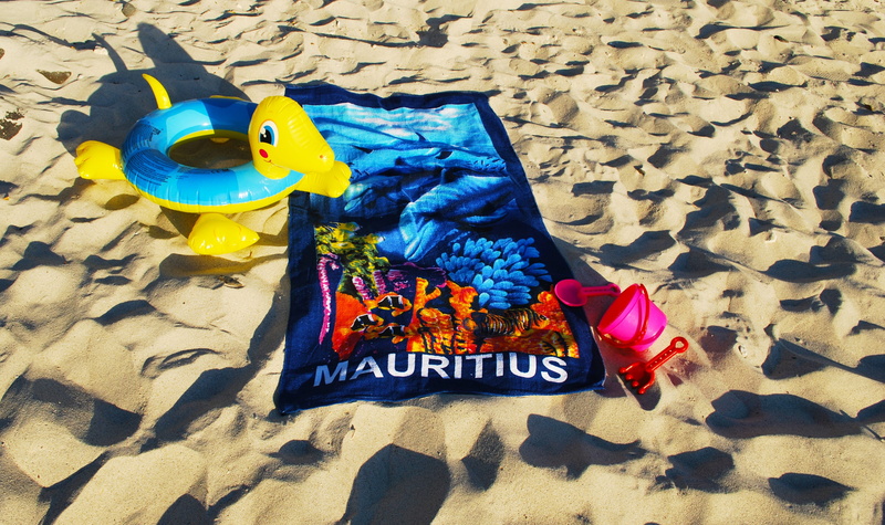 multi colored, animal representation, towel, sunlight, ring for swimming, art and craft, blue, creativity, shadow, representation, yellow, land, outdoors