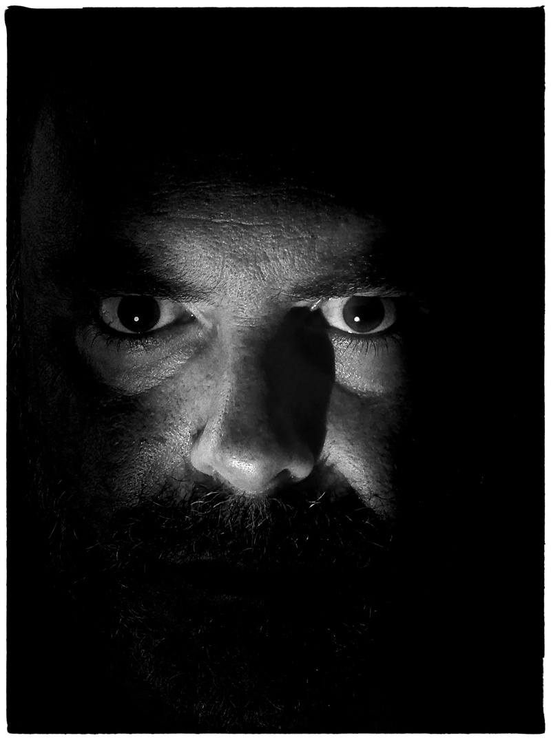 dark, real people, award, one person, looking at camera, indoors, fear, 2K, face, leisure activity, men, head, low key, philosophy, observe, transfer print
