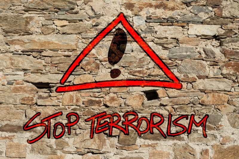 wall - building feature, crime, red, destruction, western script, no people, road sign, terror, attacks, outdoors, stone material, creativity, terrorism