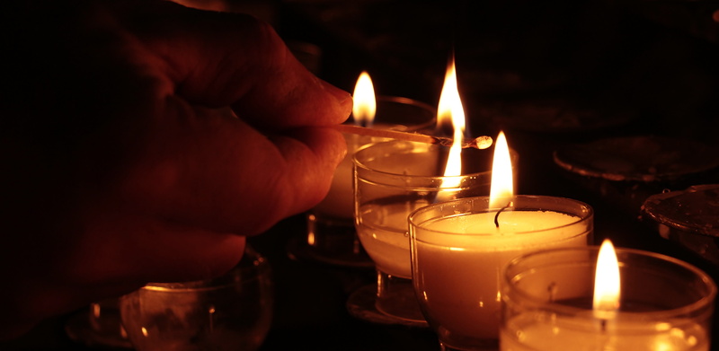 heat, faith, burn, heat - temperature, one person, indoors, mourning, contemplative, candles, flame, lighting, reflection, adult, lights, igniting, consolation