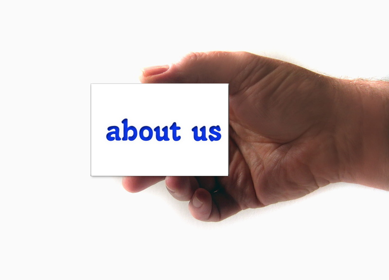 person, us, hand, paper, marketing, one person, indoors, origin, white background, corporate business, business card, human body part, pressed on, About us