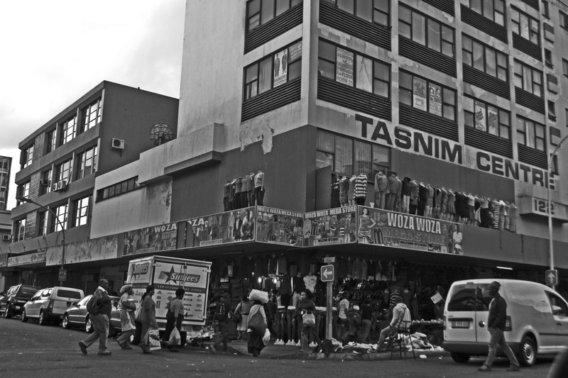 street, apartheid, town, motor vehicle, store, car, poor side, day, building exterior, black, side, mode of transportation, people, crowd, portrait, land vehicle