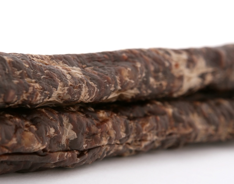 close-up, food, fat, venison, springbok, biltong, isolated, dried, cholesterol, temptation, hung, intestine, copyspace, baked, macro, focus on foreground