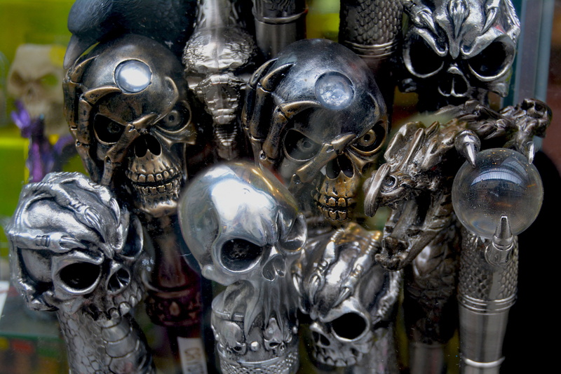 skeleton, retail, human representation, bone, large group of objects, dark, death, horror, close-up, heads, dead, photo, metallic, creepy, robotic, disguise