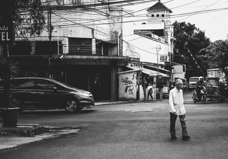 land vehicle, street, bandung city, day, motor cycle, architecture, kid, men walking, indonesia, transportation, people, trees, car, men, bike, building exterior
