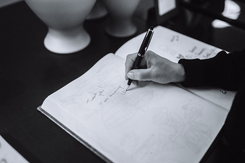paper, pen, memories, real people, one person, Guest book, design, blueprint, book, business, adult, signing, album, guest, guestbook, handwriting, log