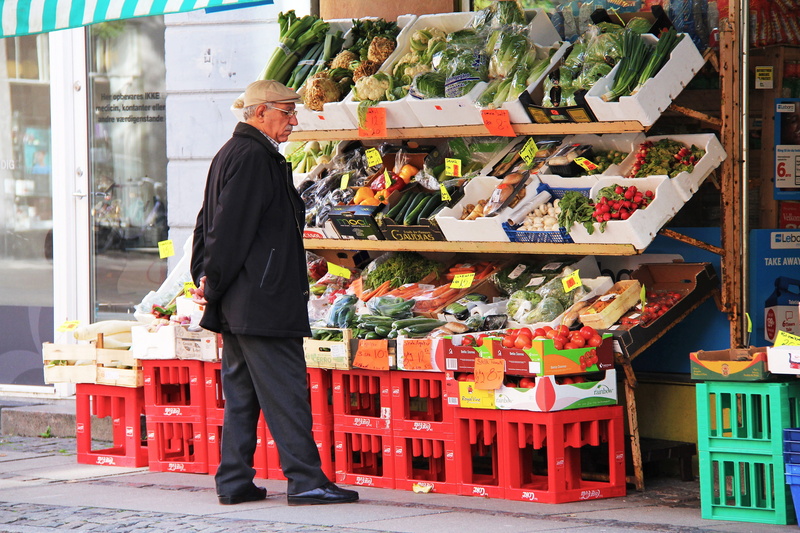 real people, 2K, local, fruits, small business, shopping, full length, colorful, display, retail, europe, one person, mature men, scandinavia, occupation