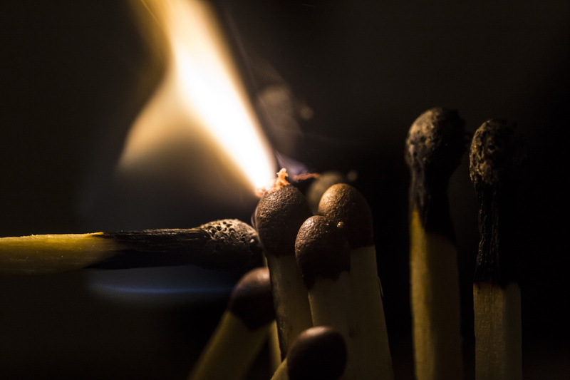 illuminated, burnt, sulfur, burning, wood - material, black background, 5K, focus on foreground, studio shot, close-up, indoors, smoke - physical structure