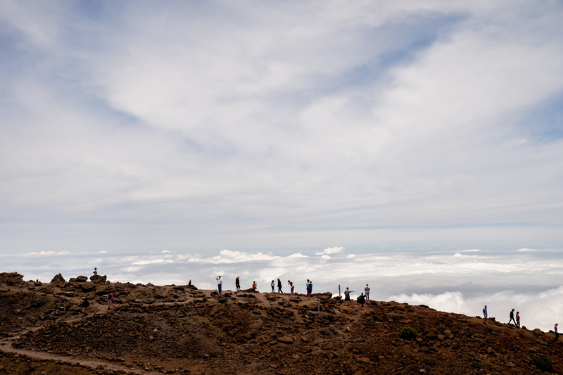 sea, sky, united states, real people, cloud - sky, lifestyles, haleakala crater, horizon, day, tranquil scene, land, outdoors, incidental people, tranquility