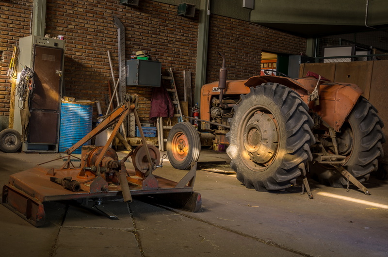 wheel, day, auto repair shop, architecture, metal, wood - material, illuminated, transportation, workshop, tire, garage, occupation, built structure, no people
