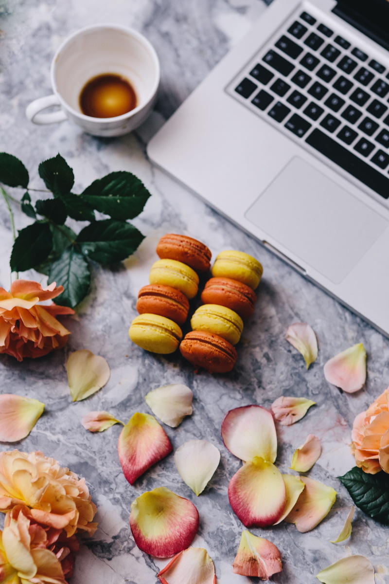 view, computer, colorfull, high angle view, food, rose petals, still life, macarons, yellow, above, no people, candy, macaron, dessert, workspace, orange