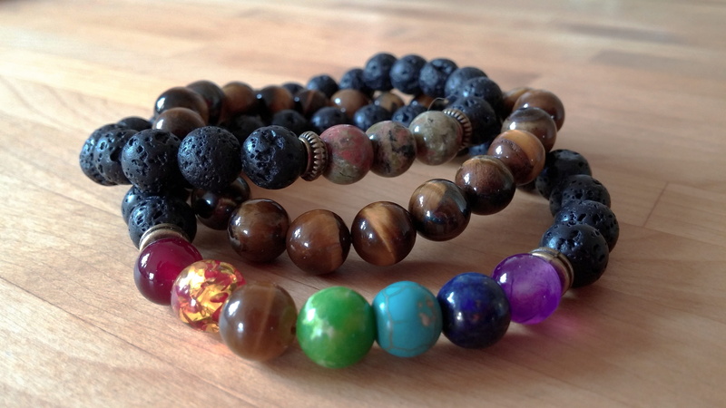 focus on foreground, black color, close-up, bracelet, jasper, no people, chakra, beads, large group of objects, multi colored, berry fruit, bead, gemstone