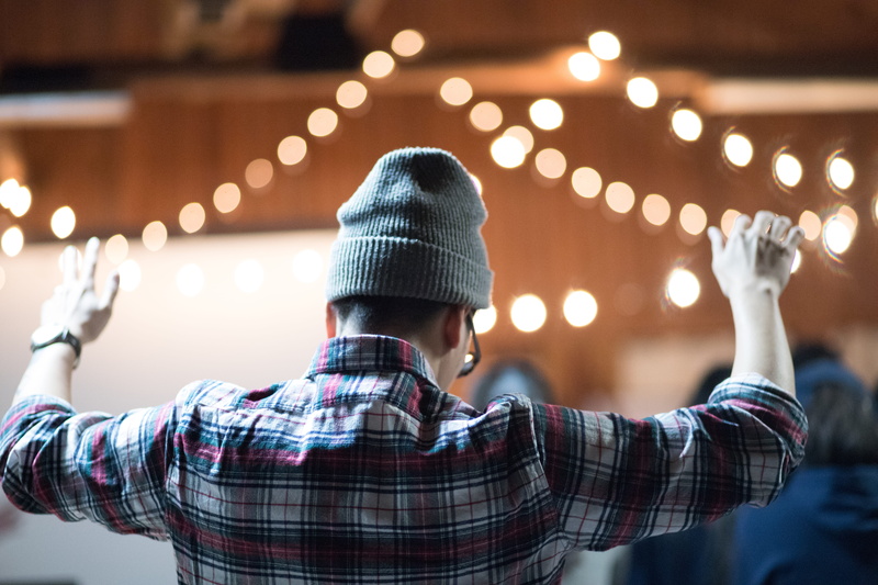 lifestyles, worship, warm clothing, knit hat, hat, rear view, lights, indoors, real people, celebration, illuminated, focus on foreground, human arm, 5K