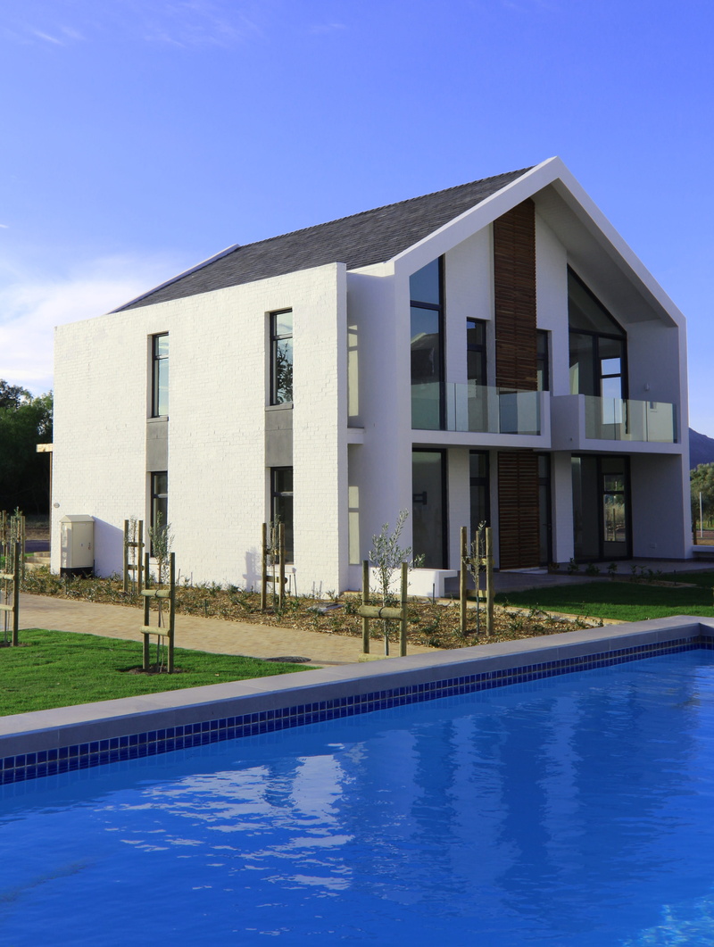 sky, modern, poolside, swimming pool, no people, luxury, val de vie estate, day, house, nature, building exterior, building, reflection, water, clear sky