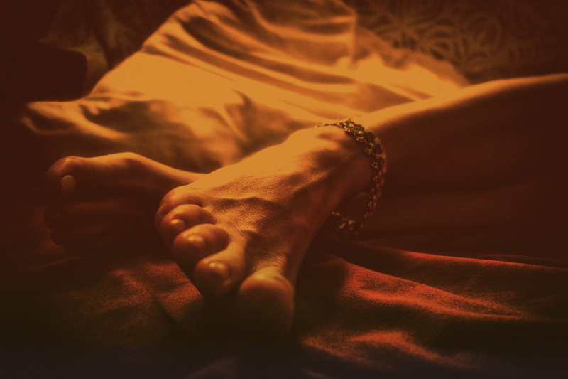 human face, soft, headshot, indoors, feet, 5K, real people, domestic room, lying down, bedroom, toes, human body part, tanzania, jewelery, intimacy, adult
