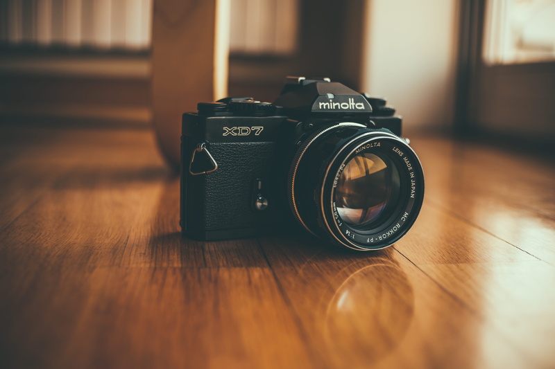 analog, closeup, black, digital camera, vintage, old, detail, 5K, slr camera, hardwood floor, surface level, no people, floor, brown, close-up, old school