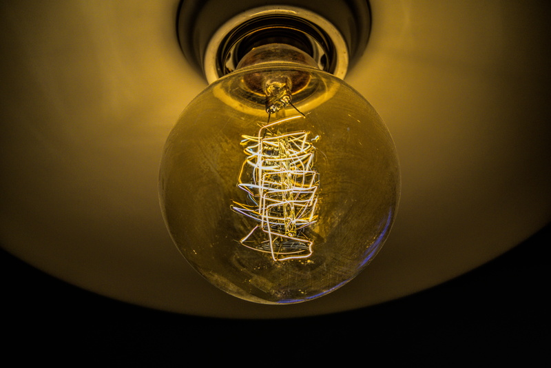 glowing, lighting, indoors, thought, electric light, 5K, darkness, version, light bulb, close-up, ceiling, yellow, filament, black background, light, idea