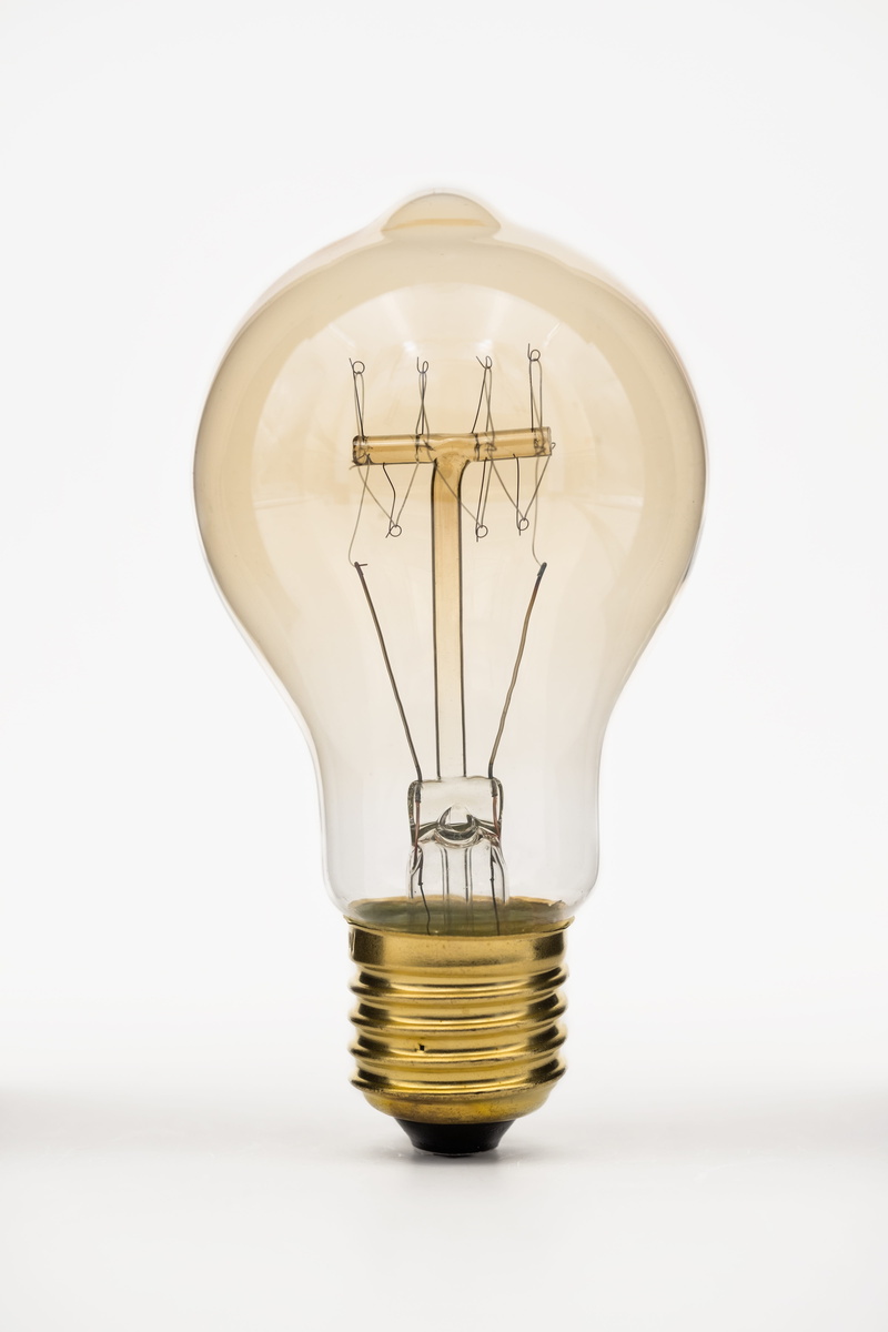 cut out, current, power supply, creativity, light, glass - material, single object, electrical engineering, indoors, filament, glow wire, disappearing