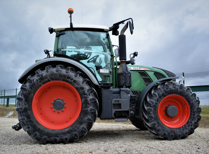 machine, agricultural equipment, machinery, field, tractor, land vehicle, outdoors, no people, day, mode of transportation, transportation, cloud - sky