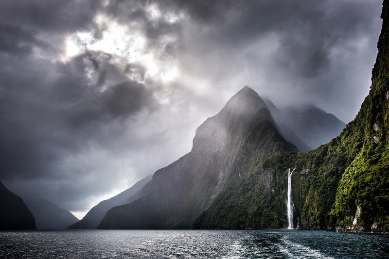 mountain, beauty in nature, waterfront, tranquility, no people, outdoors, water, waterfalls, mist, power in nature, non-urban scene, sea, storm, clouds