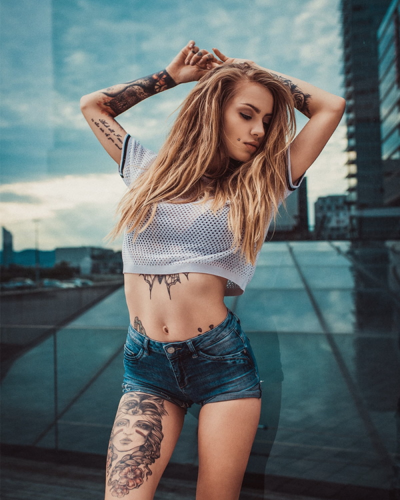 brunette, outdoors, women, model, skinny, crop top, pierced cheeks, inked girls, belly, women outdoors, jean shorts, 720P, tattoo, portrait display, glass