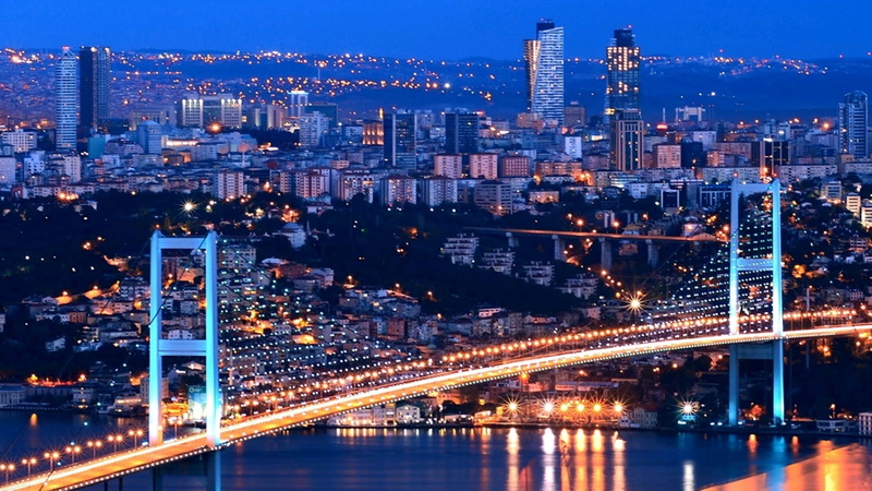 building, city, outdoors, building exterior, water, illuminated, city life, bridge - man made structure, river, travel destinations, bridge, built structure