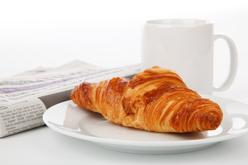 drink, break, cup, espresso, coffee cup, mug, croissant, gourmet, baked pastry item, french food, cafe, newspaper, indoors, tea, plate, paper, ceramic