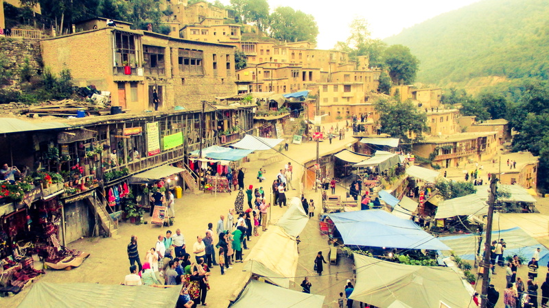 nature, real people, women, crowd, iran, mountain, group of people, built structure, outdoors, architecture, building exterior, high angle view, market