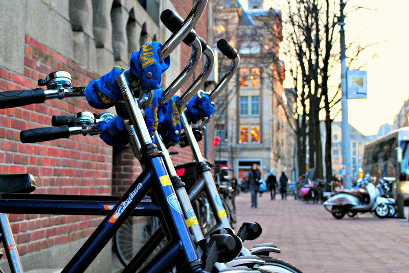 town, transport, motor vehicle, Amsterdam, urban, cityscape, street, architecture, built structure, incidental people, building exterior, outdoor, mode of transportation
