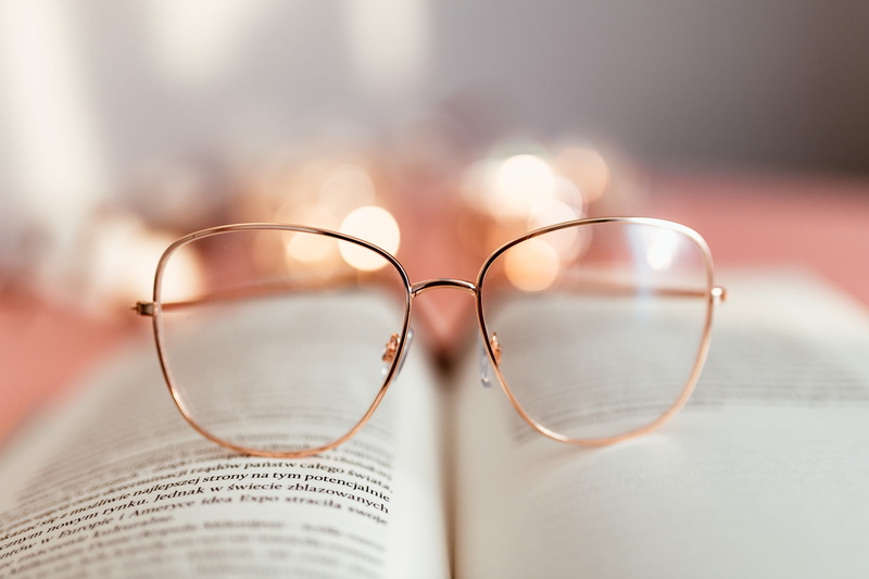 still life, glasses, close-up, pink, focus on foreground, eyesight, eyewear, open, learning, feminine, indoors, business, lens - eye, reading, eyeglasses