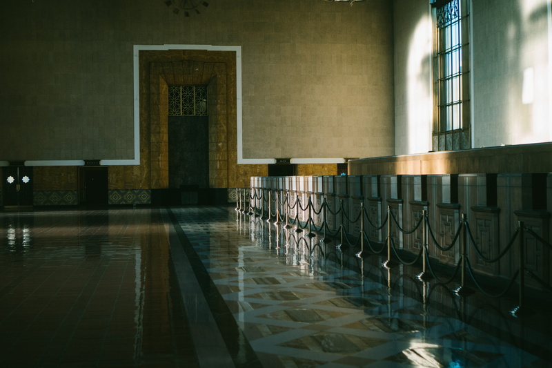 in a row, architecture, reflection, built structure, brown, indoors, subway, wall - building feature, dining table, nature, empty, underground, interior