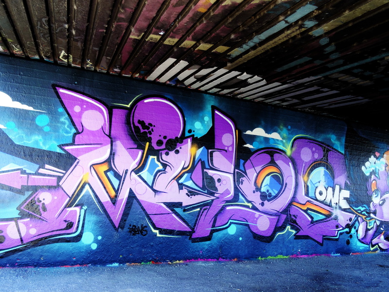 human representation, street art, architecture, wall - building feature, mural, wall, art and craft, western script, paint, day, representation, text, streets of art