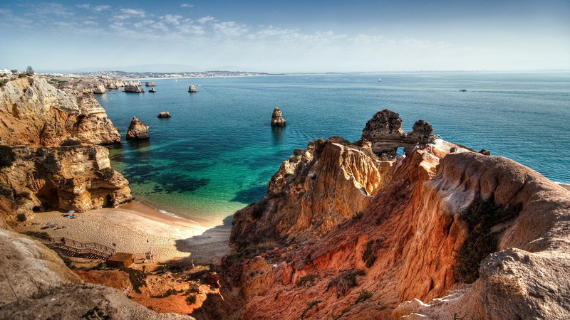 horizon over water, beauty in nature, beach, travel, sea, day, tranquil scene, brown, land, water, no people, ocean, eroded, sky, tranquility, rock, rocky coastline