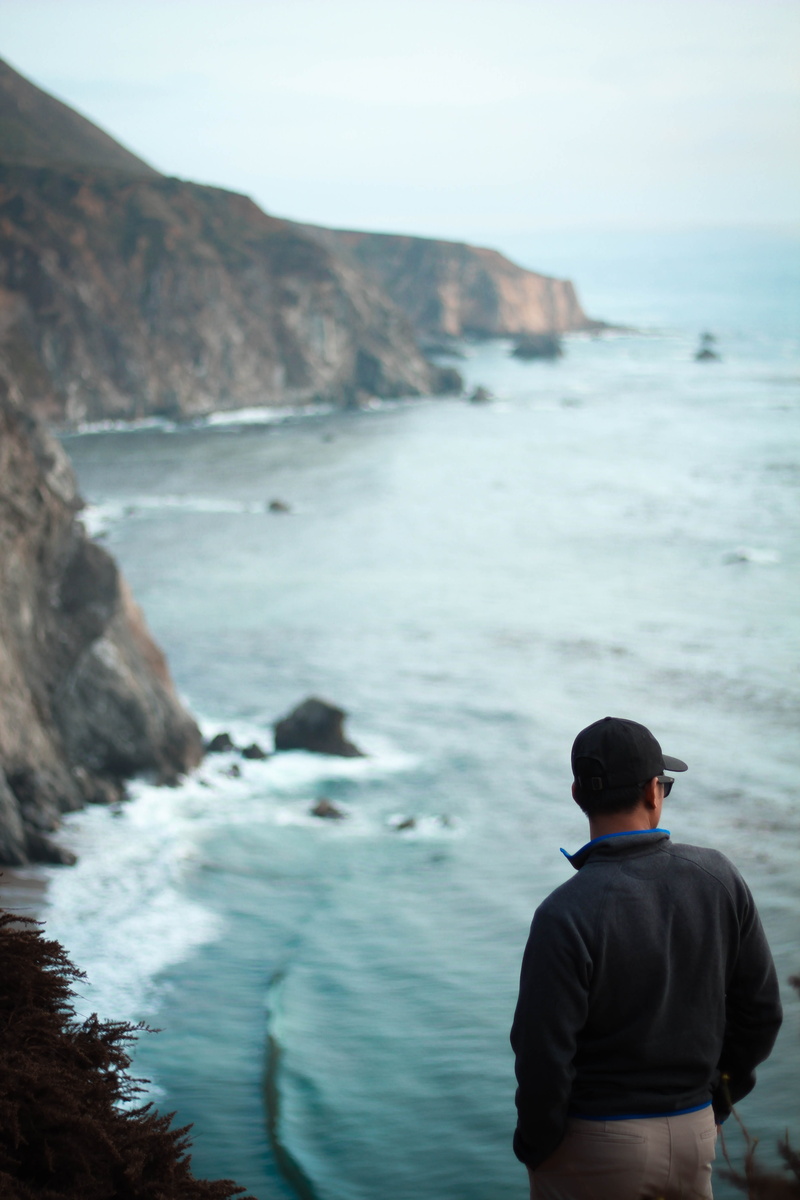 usa, three quarter length, cliff, beauty in nature, human, hat, day, body, sea waves, ocean, big sur, front, motion, rock, scenics - nature, men, leisure activity