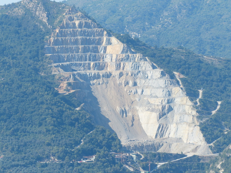 snowcapped mountain, quarry, tranquil scene, beauty in nature, cold temperature, rock edge, day, high angle view, marble, rock, depletion, mining, green